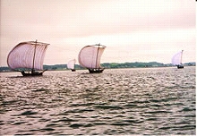 5 cloth sailboats all sailing together